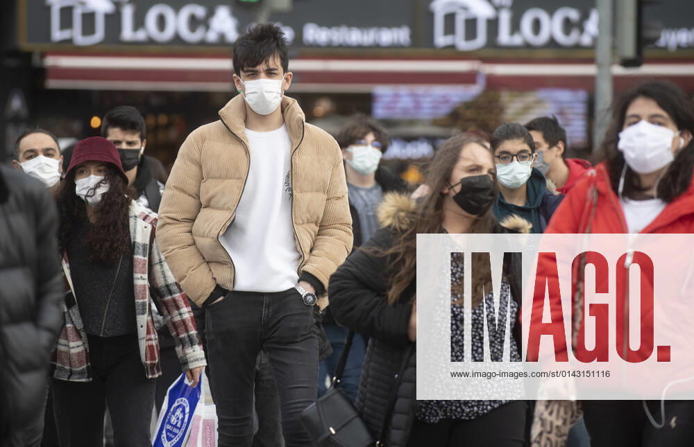 People wearing face masks walk on a street in Ankara, Turkey, on November 28, 2021. Turkey confirmed 21,655 new COVID-19 cases, raising its tally of infections to 8,746,055 according to its health ministry. Some 213 persons died of Covid-9 today, increasing the death toll from the virus in Turkey to 76,446. (