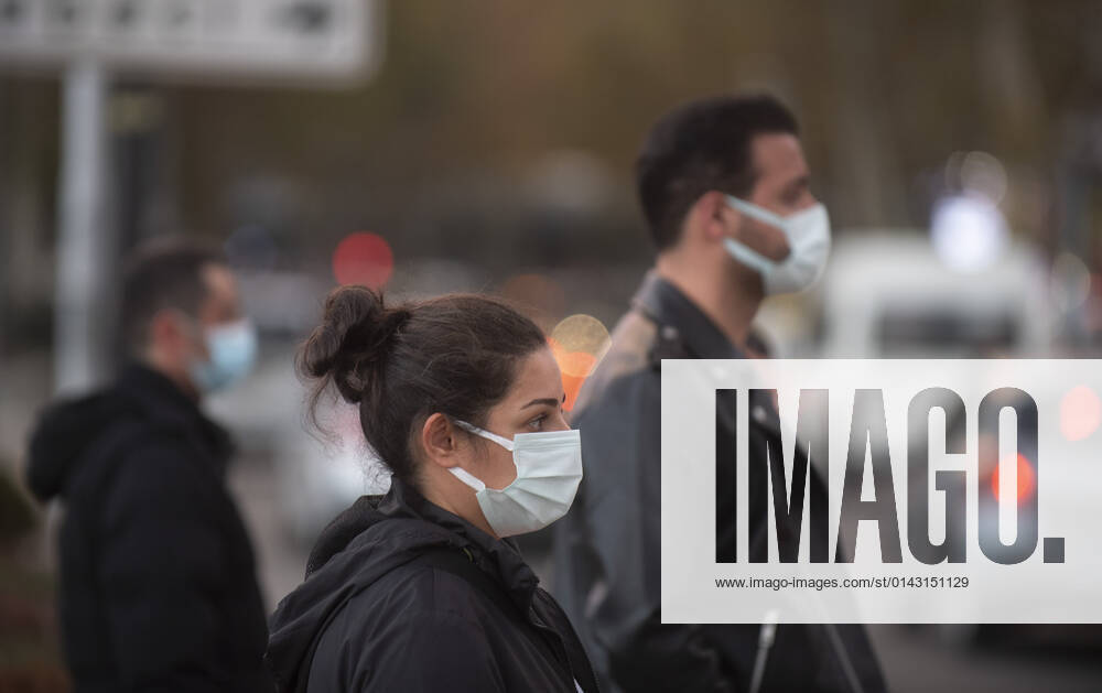 People wearing face masks walk on a street in Ankara, Turkey, on November 28, 2021. Turkey confirmed 21,655 new COVID-19 cases, raising its tally of infections to 8,746,055 according to its health ministry. Some 213 persons died of Covid-9 today, increasing the death toll from the virus in Turkey to 76,446. (