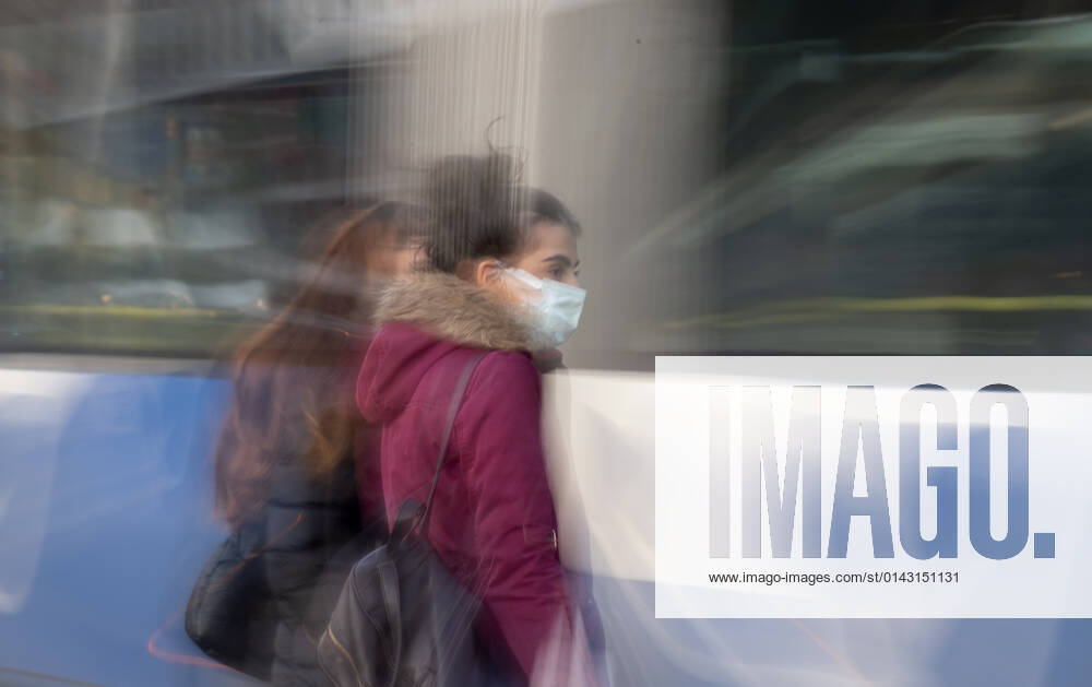 People wearing face masks walk on a street in Ankara, Turkey, on November 28, 2021. Turkey confirmed 21,655 new COVID-19 cases, raising its tally of infections to 8,746,055 according to its health ministry. Some 213 persons died of Covid-9 today, increasing the death toll from the virus in Turkey to 76,446. (