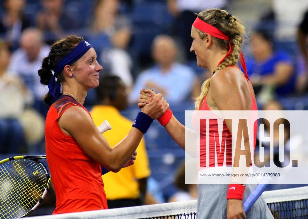 Dinah Pfizenmaier of Germany (L) and Victoria Azarenka of Belarus shake hands at the conclusion of their round-one match where Pfizenmaier lost in two sets at the U.S. Open Championship held at the USTA BillieJeanKing National Tennis Center on August 27, 2013 in New York City. NYP20130827338
