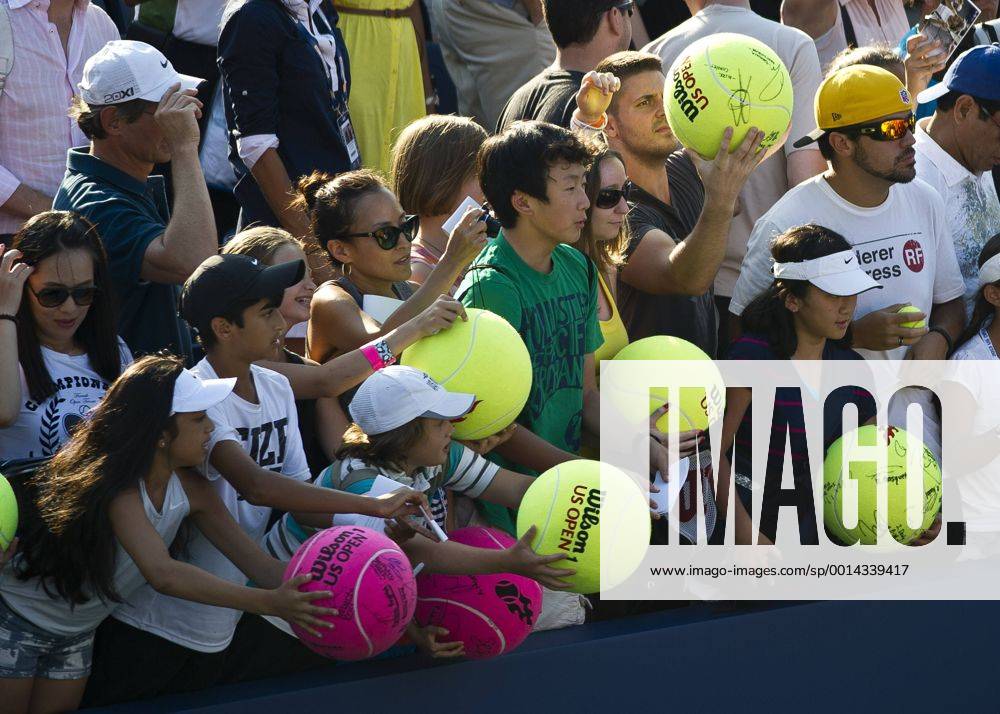 Aug. 27, 2013 - Flushing, Queens, New York, U.S - August 27, 2013: Young fans wait to have their tennis balls signed at court side on Day 2 of the 2013 U.S. Open Tennis Championships at the USTA BillieJeanKing National Tennis Center in Flushing, Queens, New York. TENNIS 2013: US OPEN Championship AUG 27 - ZUMAc04