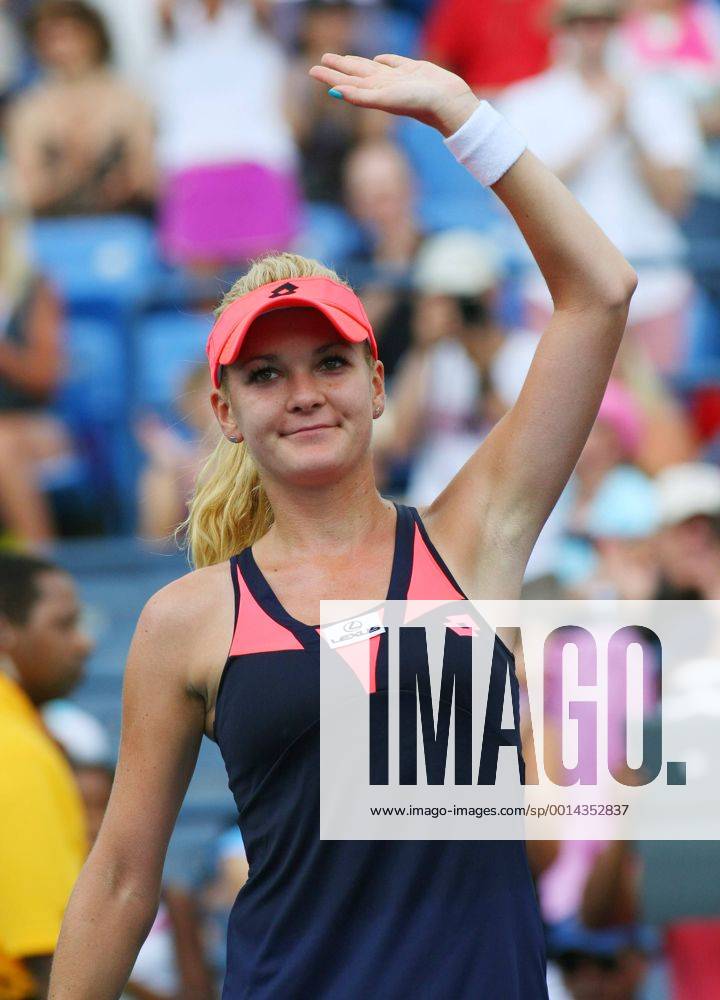Agnieszka Radwanska of Poland waves to the crowd after defeating during round-two action at the U.S. Open Championship held at the USTA Billie Jean King National Tennis Center on August 28, 2013 in New York City. NYP20130828307