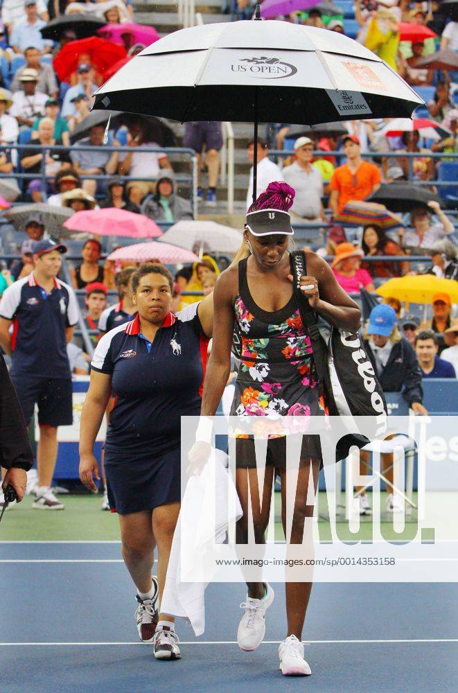 Venus Williams (USA) is escorted off the court as another rain delay suspends play at the US Open Championship at the USTA Billie Jean King National Tennis Center on August 28, 2013 in New York City. UPI Photo Monika Graff NYP20130828318