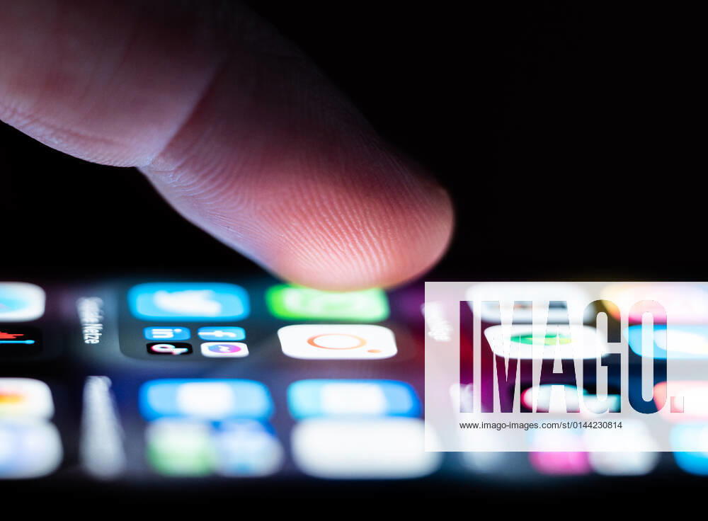 A man operates an iPhone SE on which numerous application apps are installed Rottweil Baden Württemberg Germany