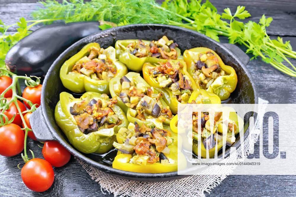 Pepper stuffed with vegetables in pan on black board, 26.10.2021,