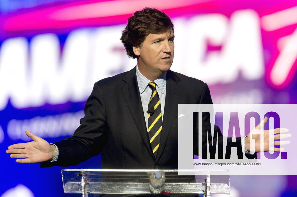 Phoenix, Arizona, USA - Fox News host TUCKER CARLSON speaks at AmericaFest, a Turning Point USA event. Phoenix USA - ZUMAce6_ 20211219_zaf_ce6_003