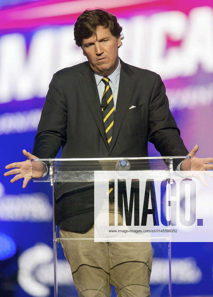 Phoenix, Arizona, USA - Fox News host TUCKER CARLSON speaks at AmericaFest, a Turning Point USA event. Phoenix USA - ZUMAce6_ 20211219_zaf_ce6_004