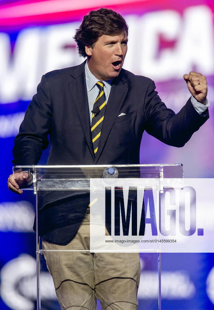 Phoenix, Arizona, USA - Fox News host TUCKER CARLSON speaks at AmericaFest, a Turning Point USA event. Phoenix USA - ZUMAce6_ 20211219_zaf_ce6_005