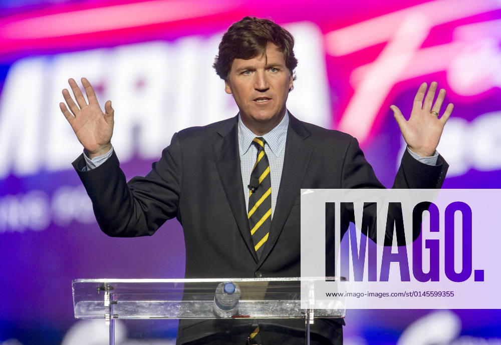 Phoenix, Arizona, USA - Fox News host TUCKER CARLSON speaks at AmericaFest, a Turning Point USA event. Phoenix USA - ZUMAce6_ 20211219_zaf_ce6_006