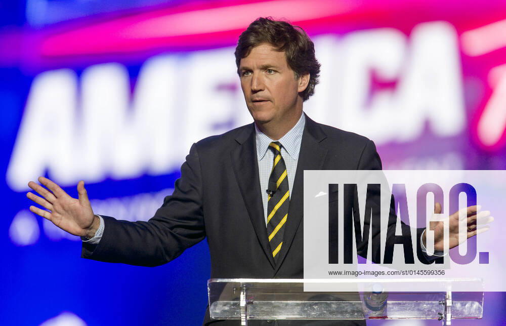 Phoenix, Arizona, USA - Fox News host TUCKER CARLSON speaks at AmericaFest, a Turning Point USA event. Phoenix USA - ZUMAce6_ 20211219_zaf_ce6_007