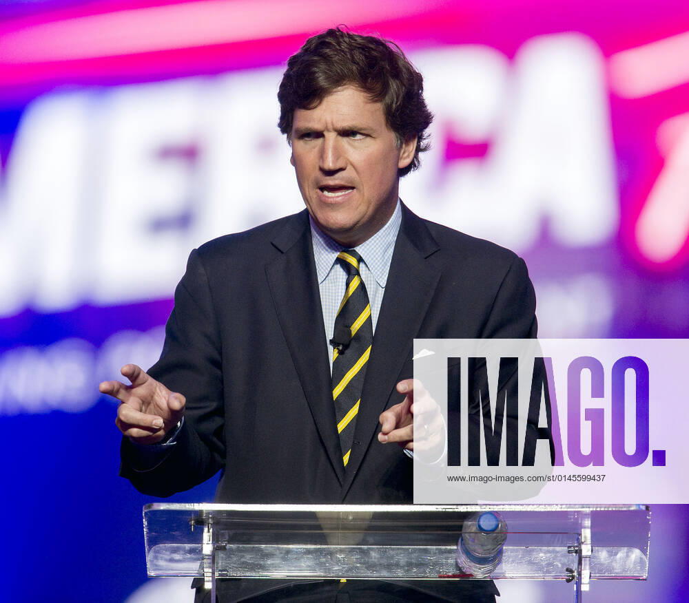 Phoenix, Arizona, USA - Fox News host TUCKER CARLSON speaks at AmericaFest, a Turning Point USA event. Phoenix USA - ZUMAce6_ 20211219_zaf_ce6_008