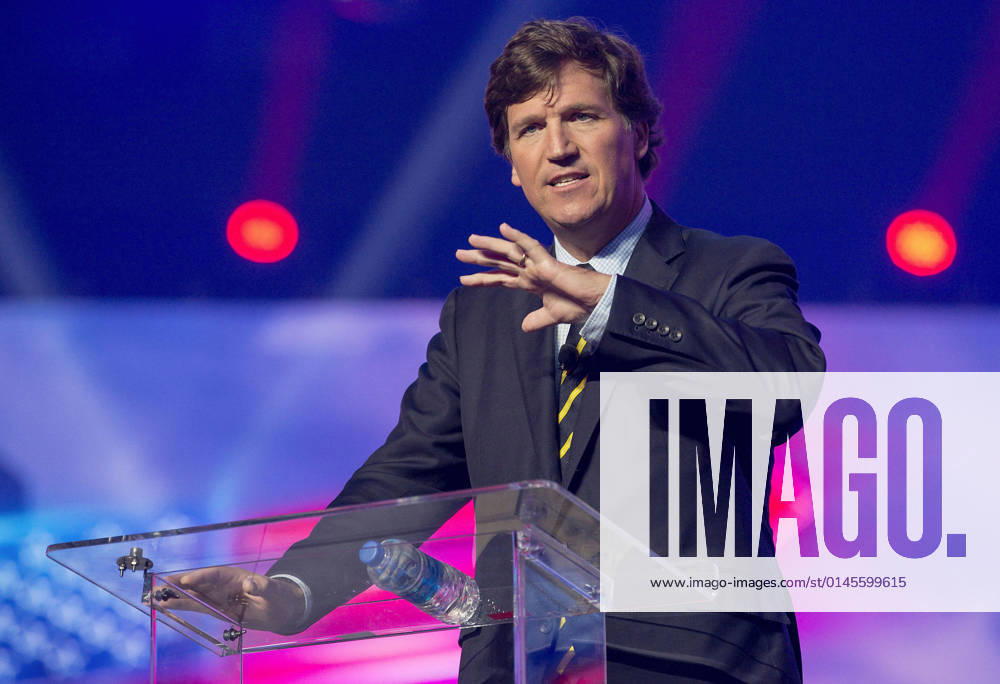 Phoenix, Arizona, USA - Fox News host TUCKER CARLSON speaks at AmericaFest, a Turning Point USA event. Phoenix USA - ZUMAce6_ 20211219_zaf_ce6_014