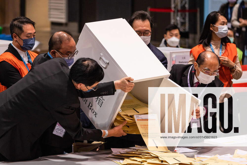 The first box of ballots was poured out by the Secretary for Constitutional and Mainland Affairs, Eric Tsang Kwok-wai, and The Chairman of the Electoral Affairs Commission Justice Barnabas Fung Wah to be counted..The 2021 Legislative Council General Election was held on December 19, as 30.2 percent turnout rate in the election, the lowest since 1997 as pro-China or pro-establishment candidates winning a sweeping victory..This is the first major election for the legislative council since the electoral system reformation, a major crackdown on pro-democratic parties and the establishment of Hong Kong National Security Law, with the introduction of Candidate Eligibility Review Committee to ensure only patrio - ZUMAs197 20211219_zaa_s197_289