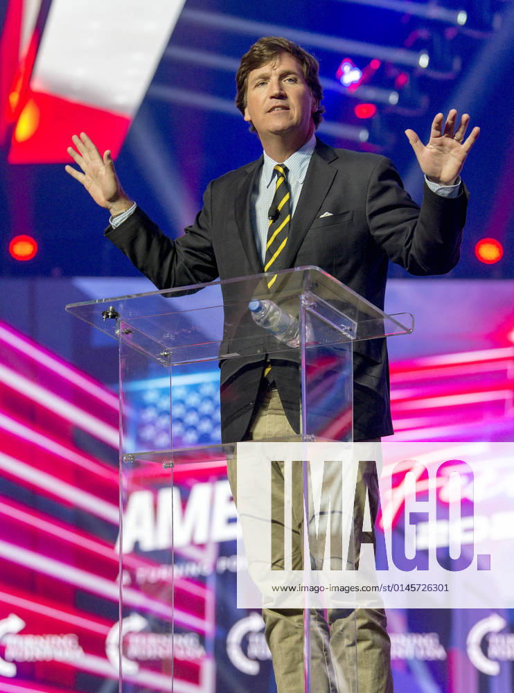 Phoenix, Arizona, USA - Fox News host TUCKER CARLSON speaks at AmericaFest, a Turning Point USA event. Phoenix USA - ZUMAce6_ 20211219_zaf_ce6_016