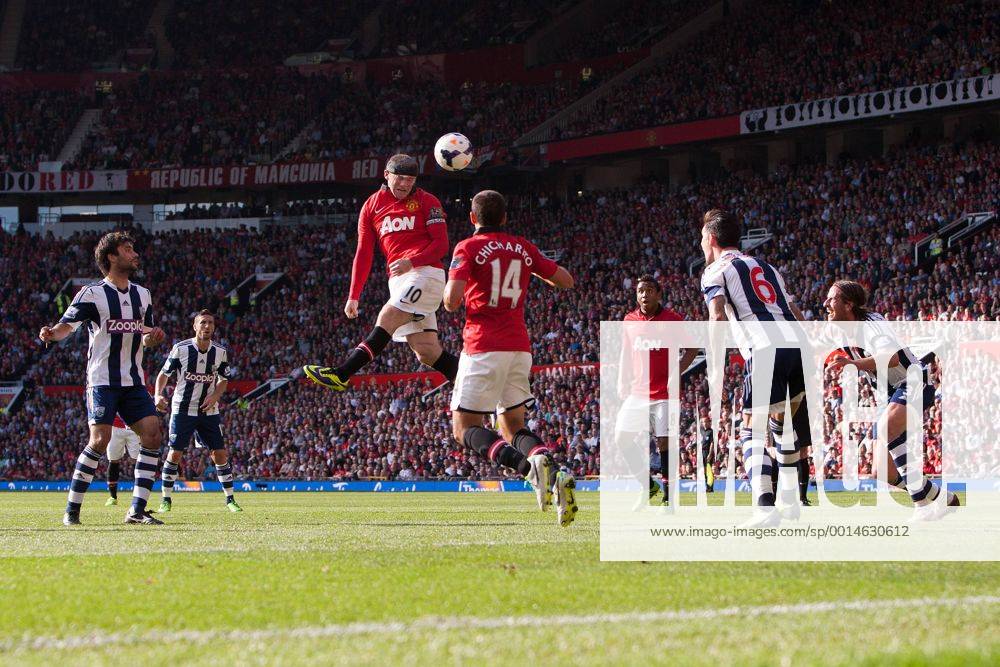 Wayne Rooney of Manchester United sends a header goalwards - Manchester United vs. West Bromwich Albion - Barclay s Premier League - Old Trafford - Manchester - 28 09 2013 Pic Philip Oldham Sportimage .