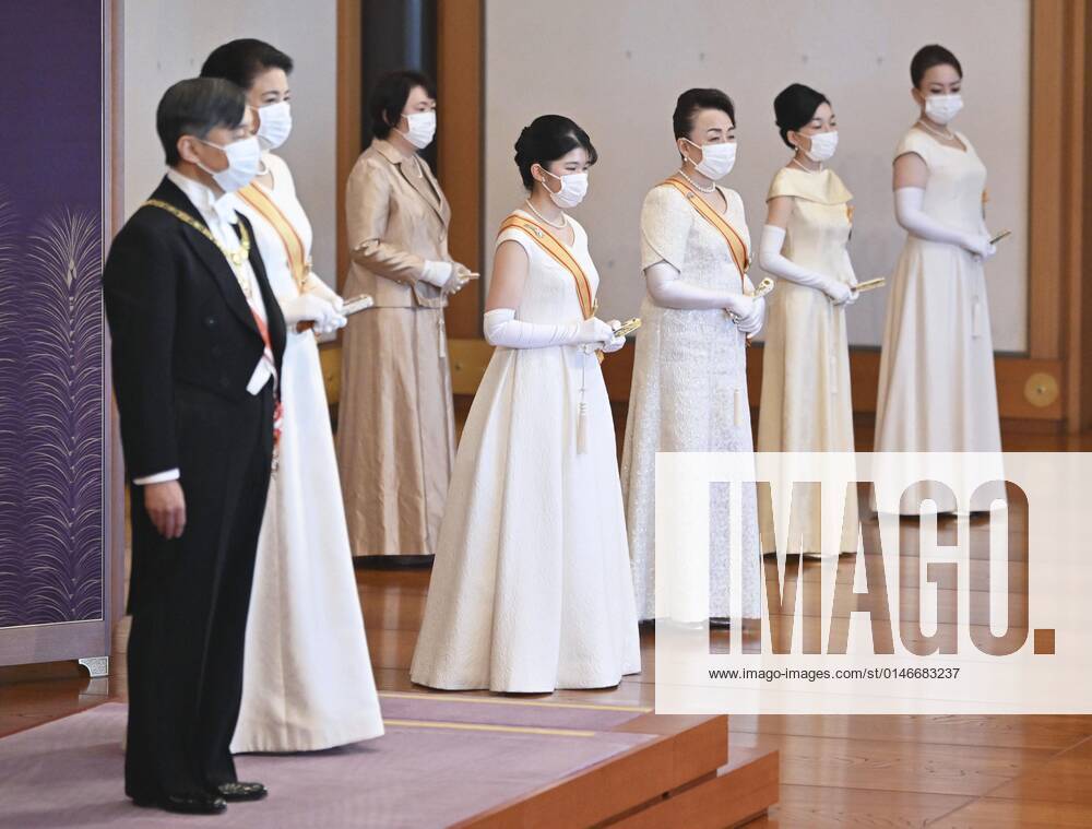 New Year ceremony by Japan s imperial family Japanese Emperor Naruhito (L) and Empress Masako (2nd from L) attend a scaled-down New Year s ceremony at the Imperial Palace in Tokyo on Jan. 1, 2022, wearing masks for protection against the coronavirus. (Pool photo) A14AA0001175249P