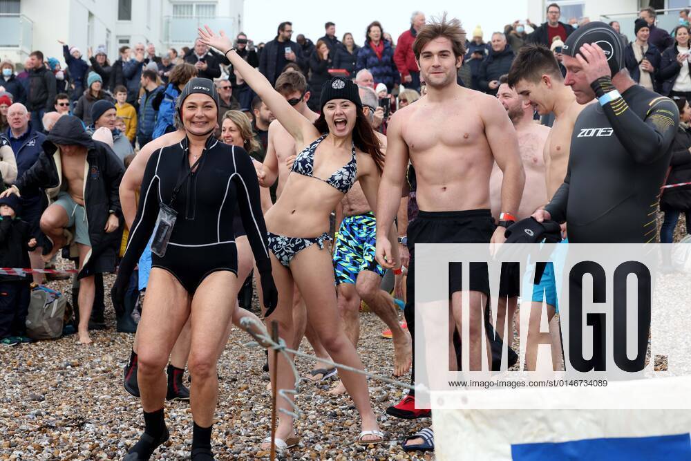 Over 350 New Year revellers, many in fancy dress, take part in the New Year Big Dip at East Wittering Beach in Chichester, West Sussex. More than double the previous record number of people took part, making the most of the warmest New YearÕs Day on record in the UK. JANUARY 1st 2022 MTXx2201