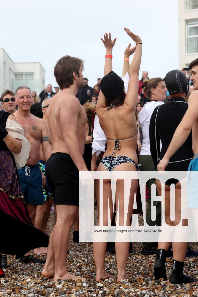 Over 350 New Year revellers, many in fancy dress, take part in the New Year Big Dip at East Wittering Beach in Chichester, West Sussex. More than double the previous record number of people took part, making the most of the warmest New YearÕs Day on record in the UK. JANUARY 1st 2022 MTXx2201