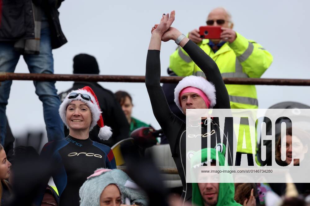 Over 350 New Year revellers, many in fancy dress, take part in the New Year Big Dip at East Wittering Beach in Chichester, West Sussex. More than double the previous record number of people took part, making the most of the warmest New YearÕs Day on record in the UK. JANUARY 1st 2022 MTXx2201
