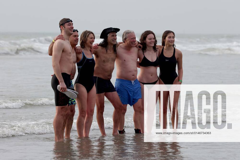 Over 350 New Year revellers, many in fancy dress, take part in the New Year Big Dip at East Wittering Beach in Chichester, West Sussex. More than double the previous record number of people took part, making the most of the warmest New YearÕs Day on record in the UK. JANUARY 1st 2022 MTXx2201