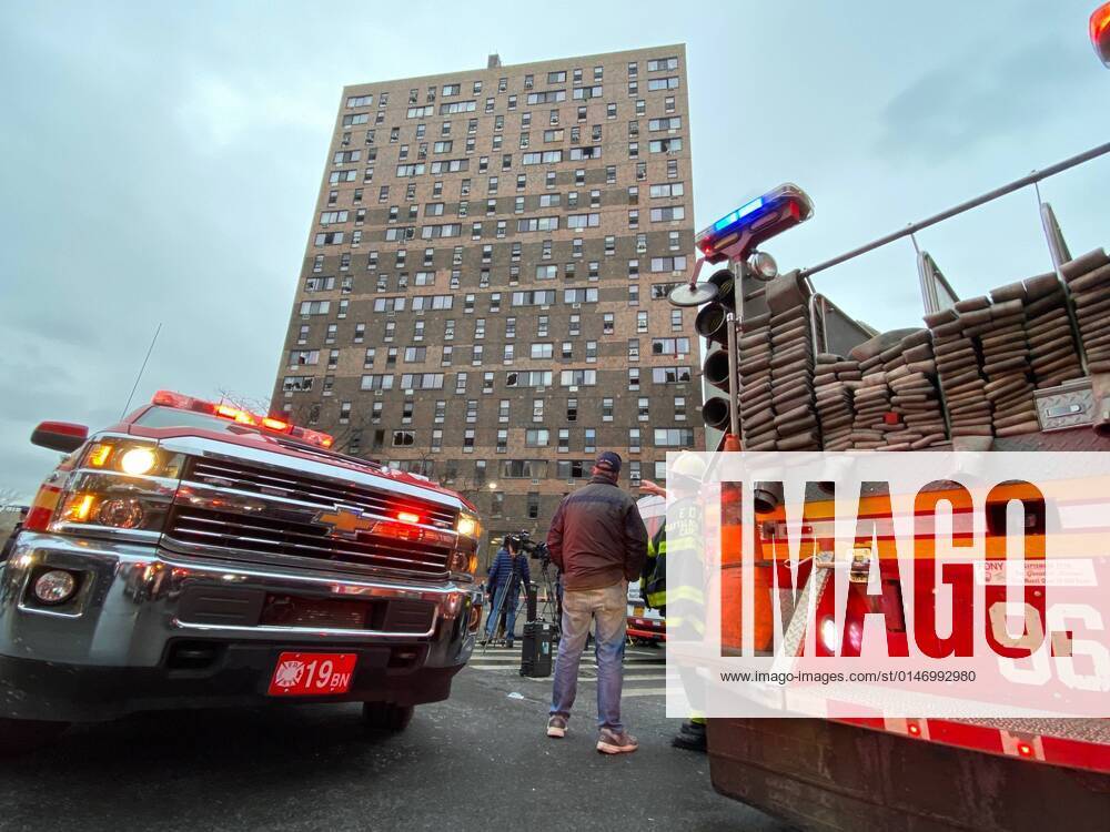 KW01 (220109) -- NEW YORK CITY, Jan. 9, 2022 -- People are seen in front of the apartment building in Bronx, New York, the United States, on Jan. 9, 2022. At least 19 people, including nine children, lost their lives in a major fire in New York City on Sunday, various U.S. media outlets reported. (Photo by Michael Nagle Xinhua) U.S.-NEW YORK CITY-APARTMENT BUILDING-FIRE WangxYing
