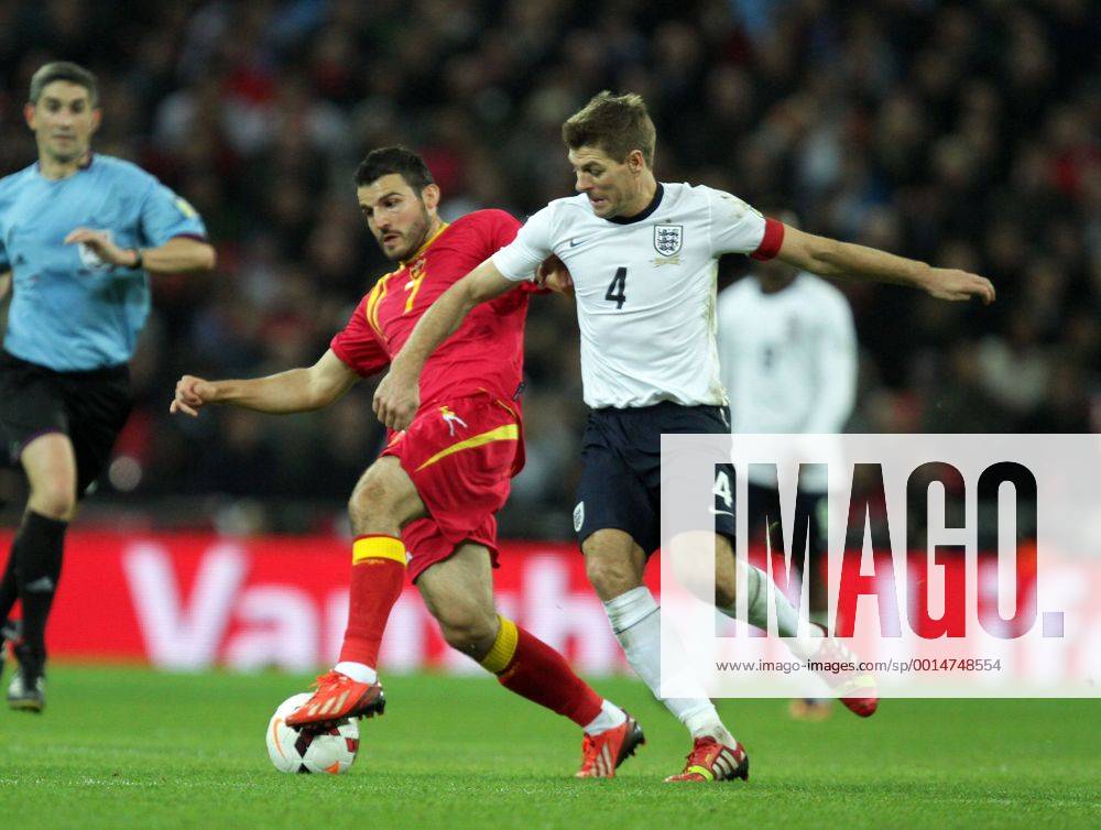 England v Montenegro - World Cup Qualifier . . Wembley, London, UK . . 11.10.2013 Simon Vukcevic (M) Steven Gerrard (E)