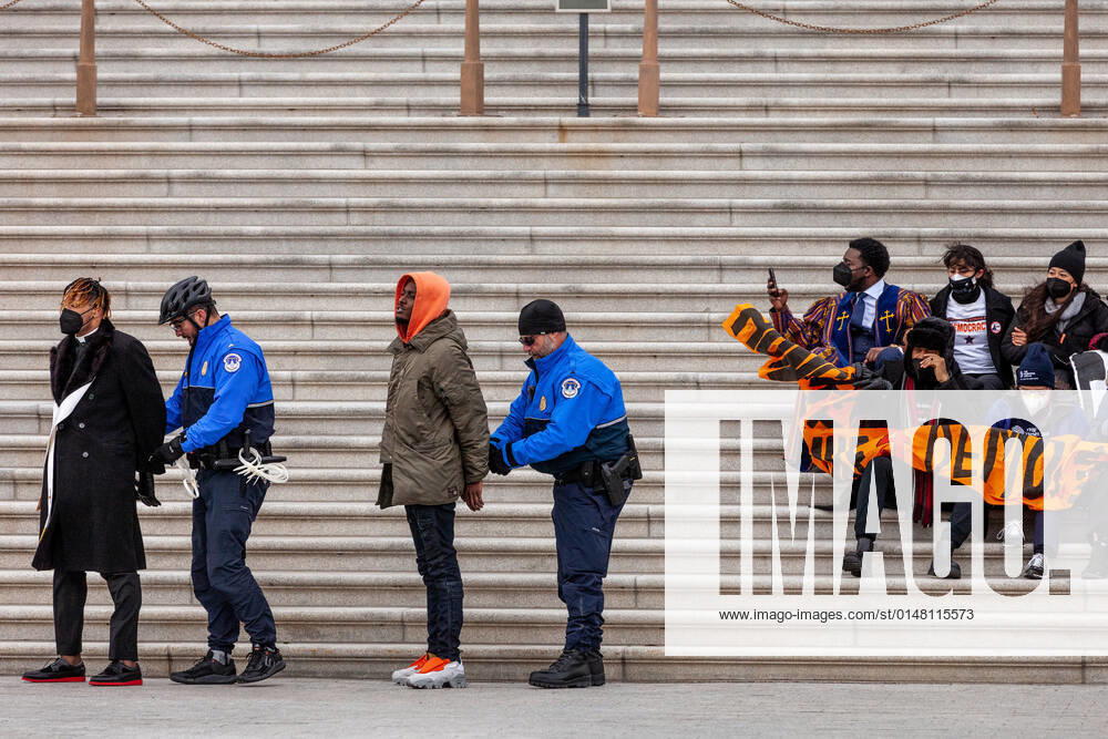 Hunger strikers for voting rights arrested at the US Capitol Capitol Police arrest and handcuff faith leaders and students on hunger strike for sitting on the steps of the Senate chamber at the US Capitol in a civil disobedience action for voting rights. They are demanding passage of the John Lewis Voting Rights Advancement Act to protect the right to vote. This is a result of the passage of voting restriction laws in 19 states in the last year. Washington DC United States