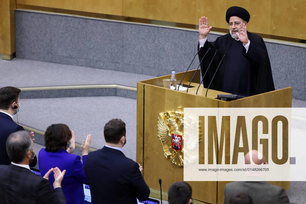 Iran s President Ebrahim Raisi (background) addresses a meeting of the Russian State Duma. Anton Novoderezhkin TASS TS11FC96