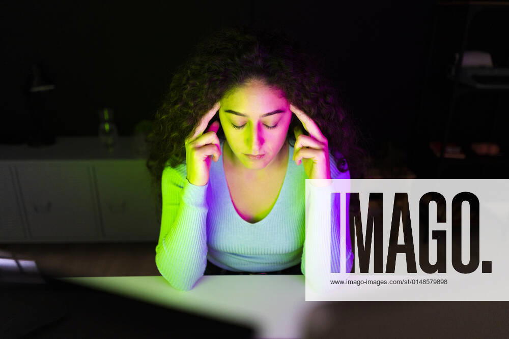 Tired businesswoman sitting at desk in home office model released property released, GIOF14639