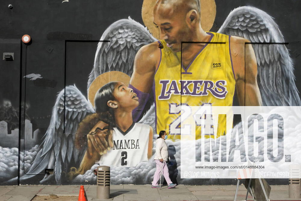A pedestrian walks past a mural of the late Los Angeles Lakers basketball star Kobe Bryant and his daughter Gianna in downtown Los Angeles, Wednesday, Jan. 26, 2022. Los Angeles USA - ZUMAc68_ 20220126_zaf_c68_001