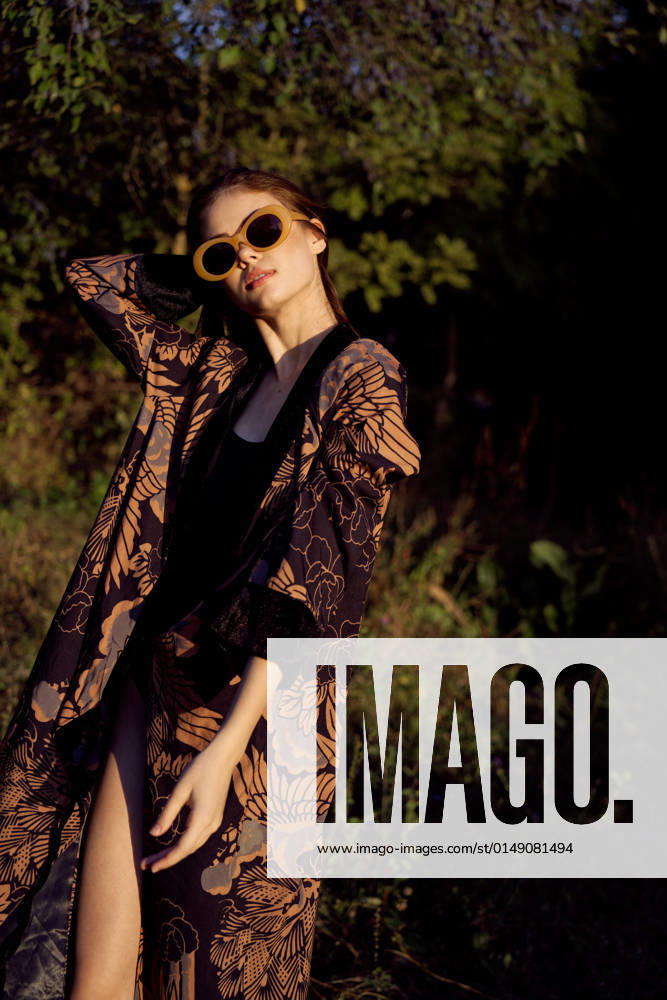 Woman wearing sunglasses outdoors posing fashion glamor woman wearing sunglasses outdoors posing fashion. High quality photo