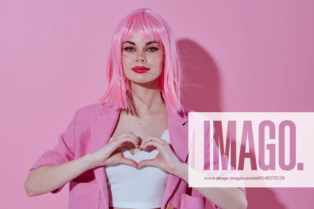 IMAGO Creative, Lifestyle, Barbiecore Positive young woman bright makeup pink hair glamor Studio Model Positive young woman bright makeup pink hair glamor Studio Model. High quality photo