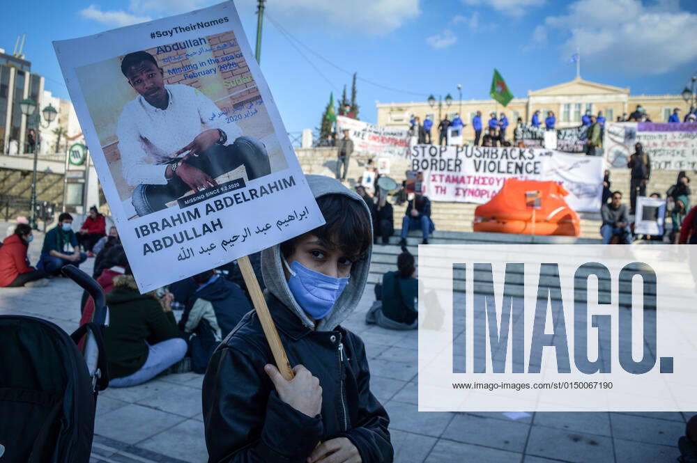 Greece: Protest against migrant pushbacks and border violence in Athens A young protester holds a sign with the picture and the name of missing migrant, during a protest against migrant pushbacks and border violence. Athens Greece