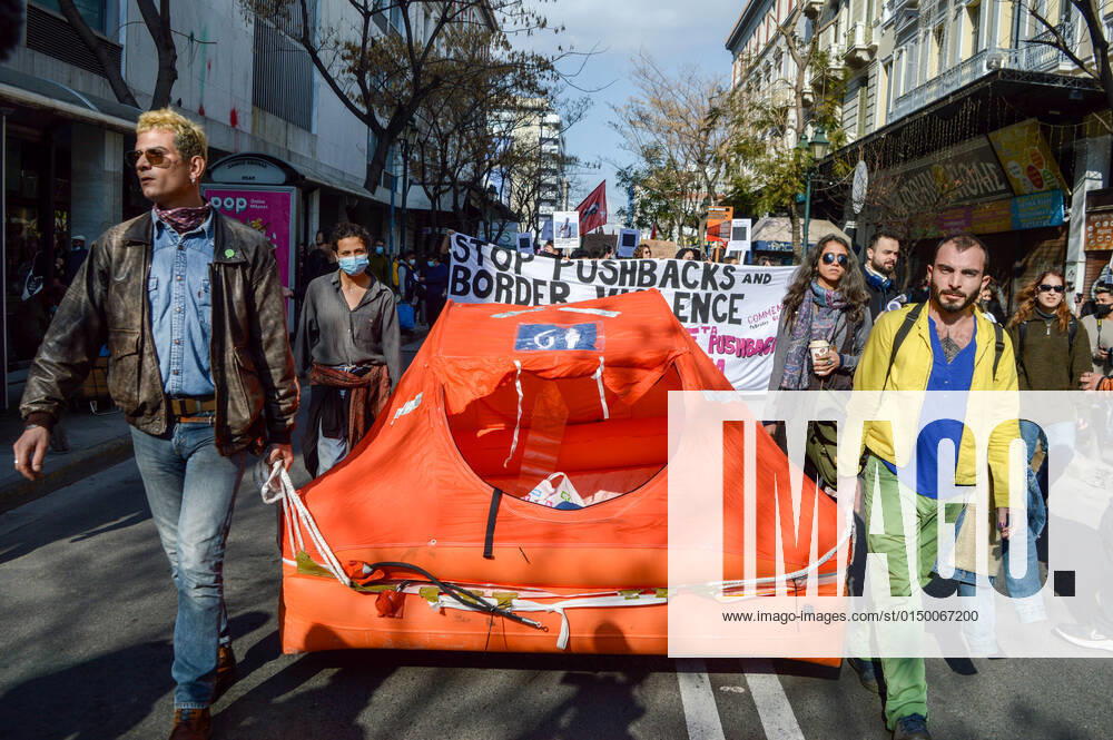 Greece: Protest against migrant pushbacks and border violence in Athens Protesters carry an inflatable dinghy, used largely by migrants to cross the seas from Turkey during a protest march against migrant pushbacks and border violence. Athens Greece