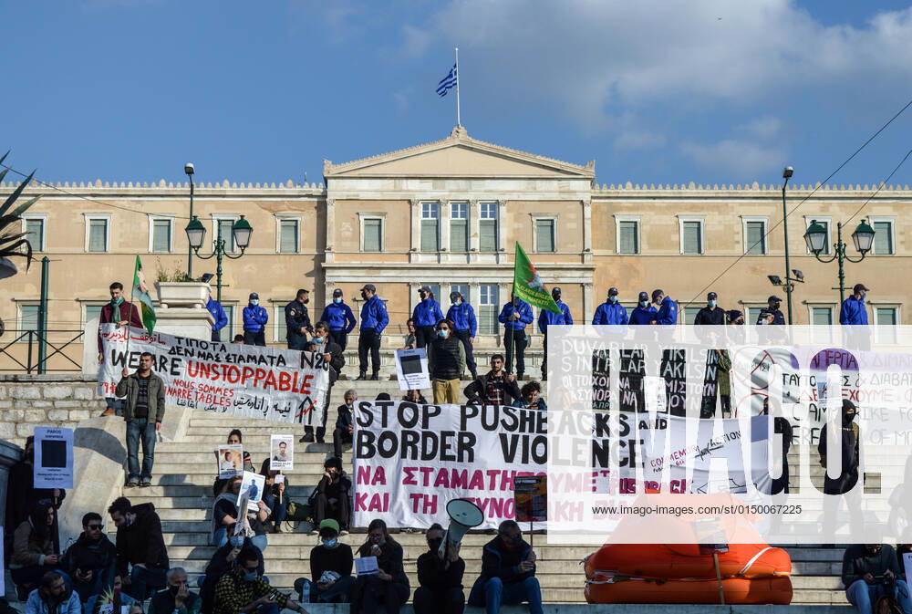 Greece: Protest against migrant pushbacks and border violence in Athens Protesters hold signs and banners reading Stop pushbacks and border violence as they stand next to a life raft with the Greek Parliament in the background in Syntagma square. Hundreds of protesters hit the streets of the Greek capital on Sunday, to protest what they say are Greece’s pushbacks of migrants and refugees at the border with Turkey. Athens Greece