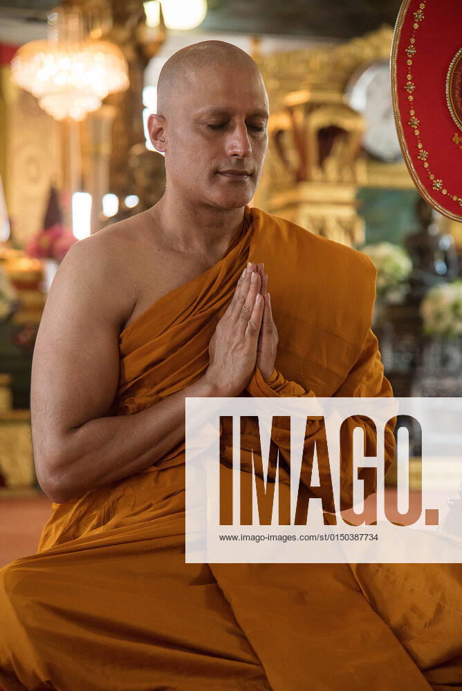 Famous Indian actor Gagan Malik, prays during the Buddhist monk ordination at Wat That Thong in Bangkok..Famous Indian actor Gagan Malik, well known for his role as Lord Buddha in the Sri Lankan film Sri Siddhartha Gauthama and for which he won the Best Actor Award in the World Buddhist Film Festival organized by the United Nations in 2014. Bangkok Thailand - ZUMAs197 20220210_zaa_s197_059