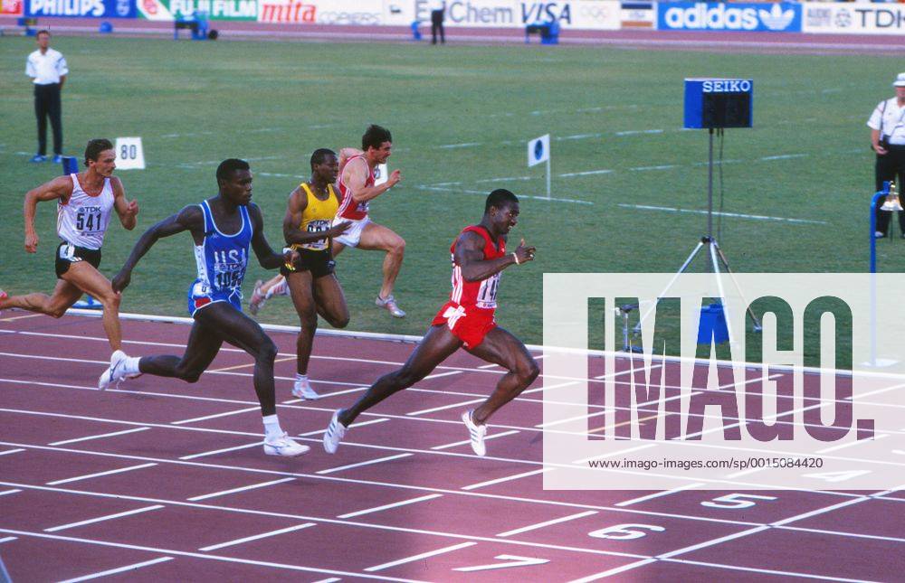 Athletics - 1987 IAAF Rome World Championships - Men s 100m Final Canada s Ben Johnson (red) shocks the world by defeating the USA s Carl Lewis (in blue) to win the race in a new World Record of 9.83s at the Stadio Olimpico. Jamaica s Raymond Stewart (yellow) is also pictured. 30 08 1987