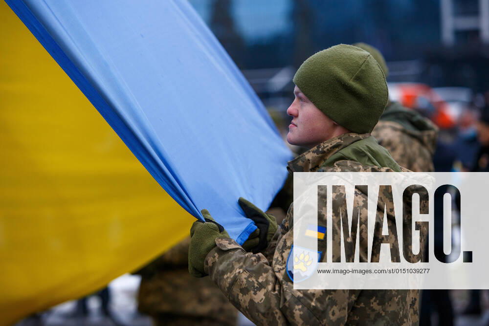 UZHHOROD, UKRAINE - FEBRUARY 16, 2022 - A soldier of the 15th Mountain Assault Battalion partakes in the ceremony of raising the State Flag of Ukraine on the tallest flag of Zakarpattia Region on the Day of Unity, Uzhhorod, Zakarpattia Region, western Ukraine. Raising of Ukrainian flag in Uzhhorod