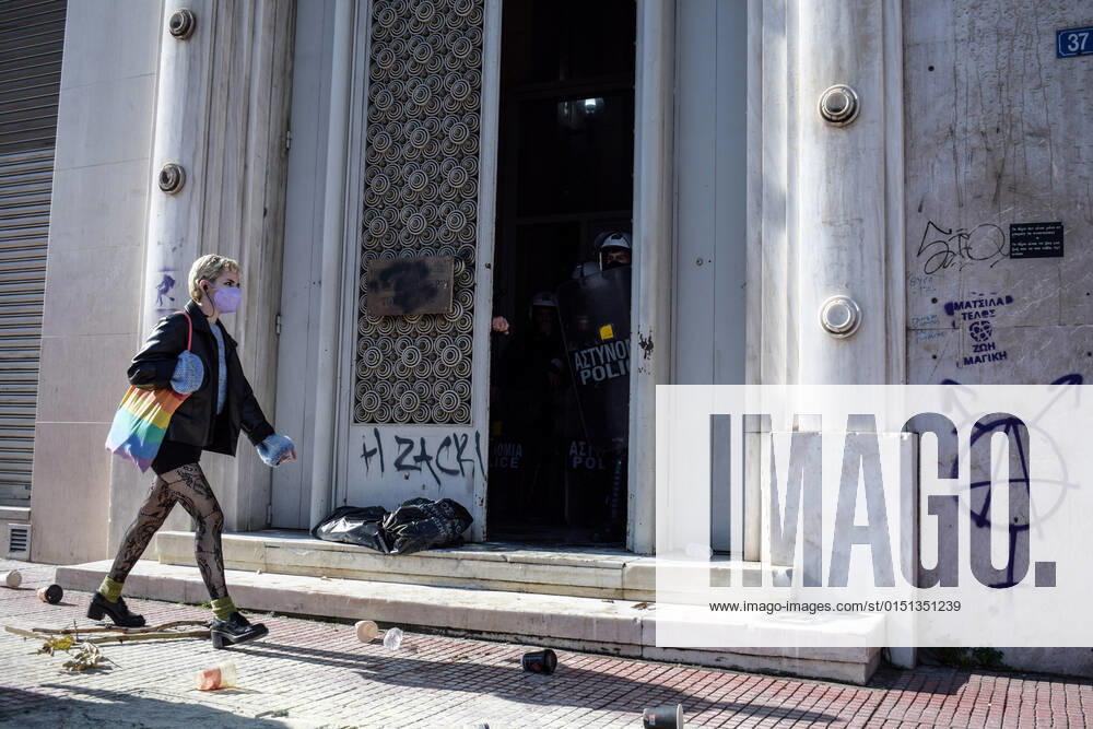 Public servants attempt to storm the General Accounting Office of the Greek State in Athens A woman walks in front of the General Accounting Office of the Greek State, shortly after public servants clashed with Police while attempting to storm the building, during a protest over the governments intention to abolish additional benefits. Greece