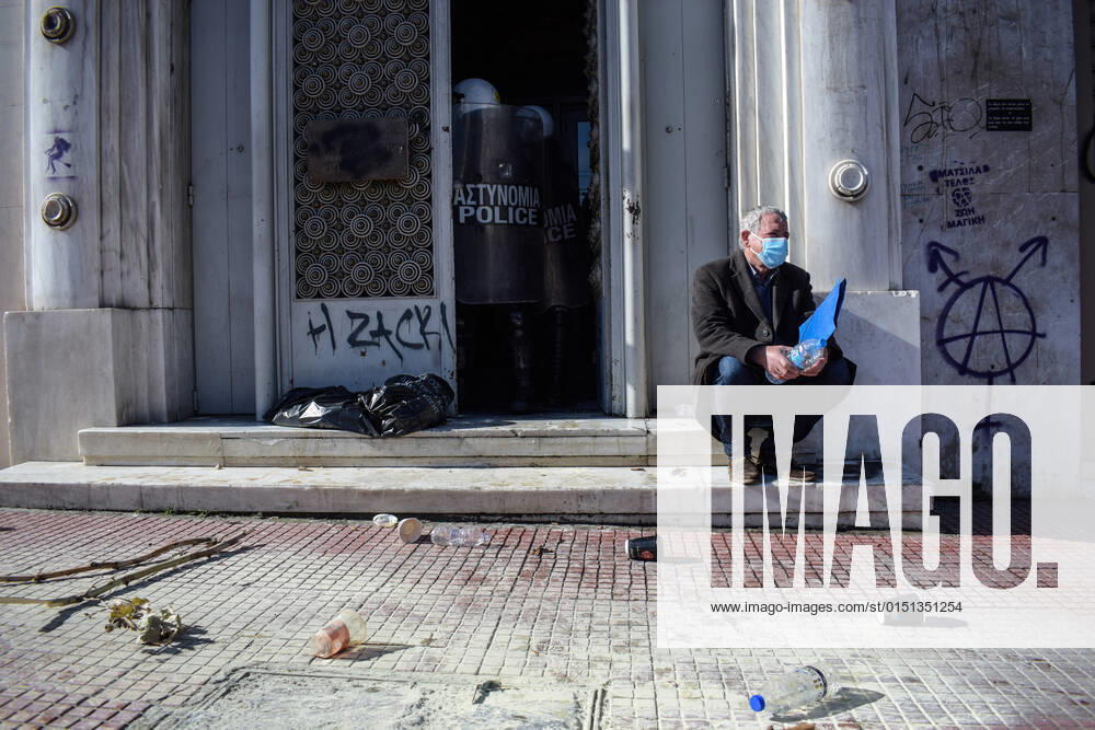 Public servants attempt to storm the General Accounting Office of the Greek State in Athens A unionist sits on the stairs in front of the Riot Police guarding the entrance of the General Accounting Office of the Greek State. Minutes ago public servants clashed with Police while attempting to storm the building during a protest over the governments intention to abolish additional benefits. Greece