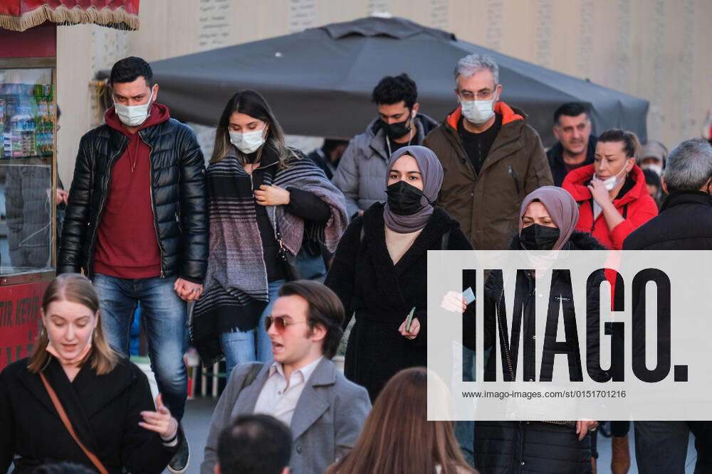 People wearing face masks walk on a street in Istanbul Turkey, on February 21, 2022. Turkey reports 85,026 newly confirmed COVID-19 cases. (