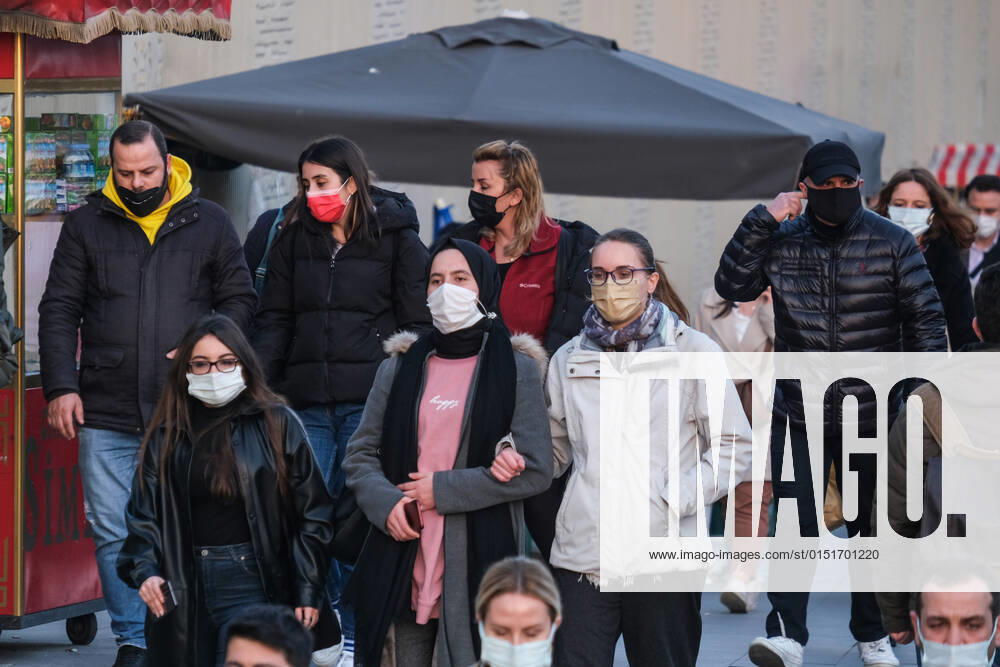 People wearing face masks walk on a street in Istanbul Turkey, on February 21, 2022. Turkey reports 85,026 newly confirmed COVID-19 cases. (