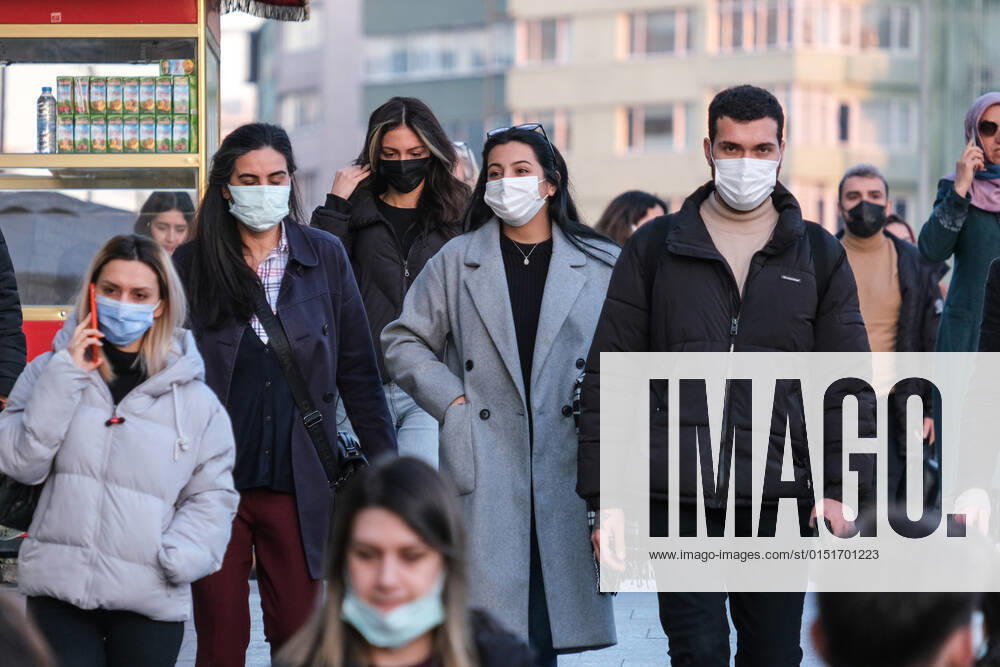 People wearing face masks walk on a street in Istanbul Turkey, on February 21, 2022. Turkey reports 85,026 newly confirmed COVID-19 cases. (