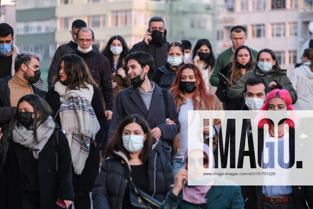 People wearing face masks walk on a street in Istanbul Turkey, on February 21, 2022. Turkey reports 85,026 newly confirmed COVID-19 cases. (