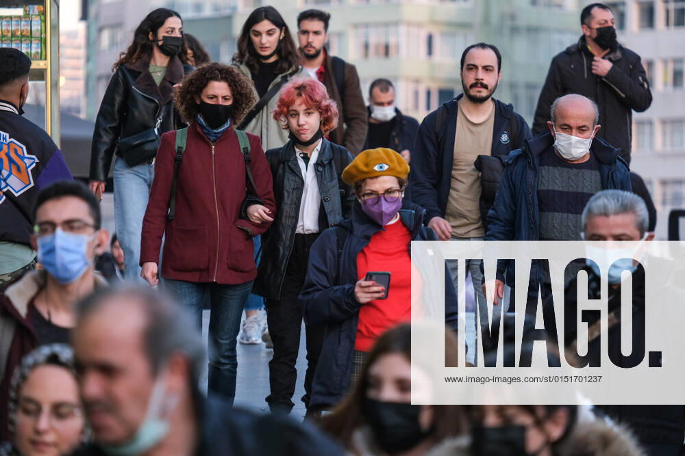 People wearing face masks walk on a street in Istanbul Turkey, on February 21, 2022. Turkey reports 85,026 newly confirmed COVID-19 cases. (