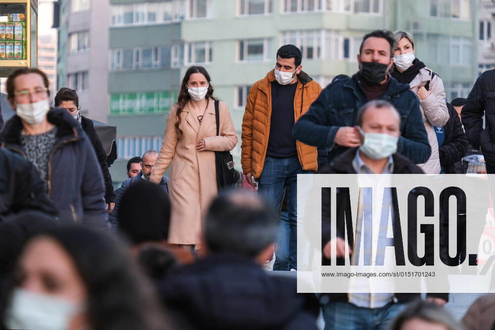 People wearing face masks walk on a street in Istanbul Turkey, on February 21, 2022. Turkey reports 85,026 newly confirmed COVID-19 cases. (