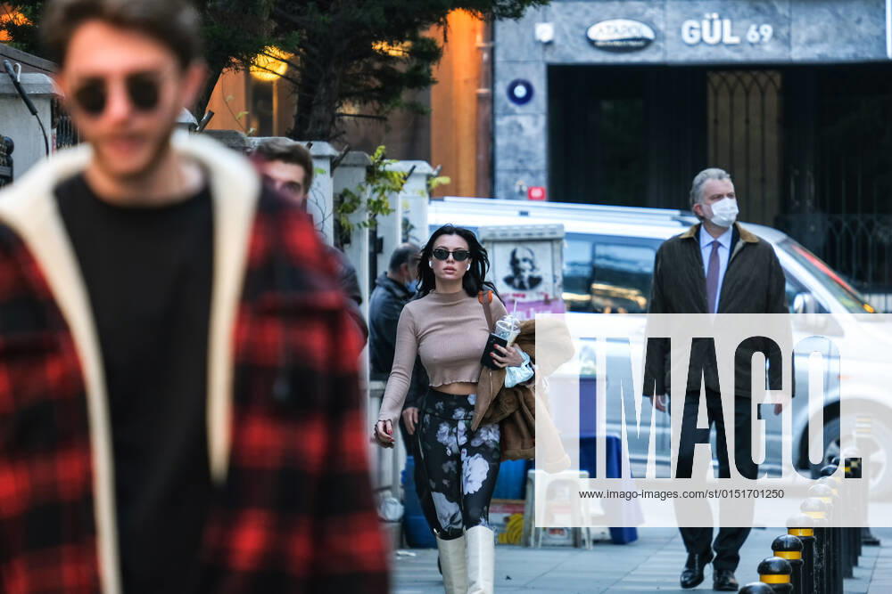 People wearing face masks walk on a street in Istanbul Turkey, on February 21, 2022. Turkey reports 85,026 newly confirmed COVID-19 cases. (
