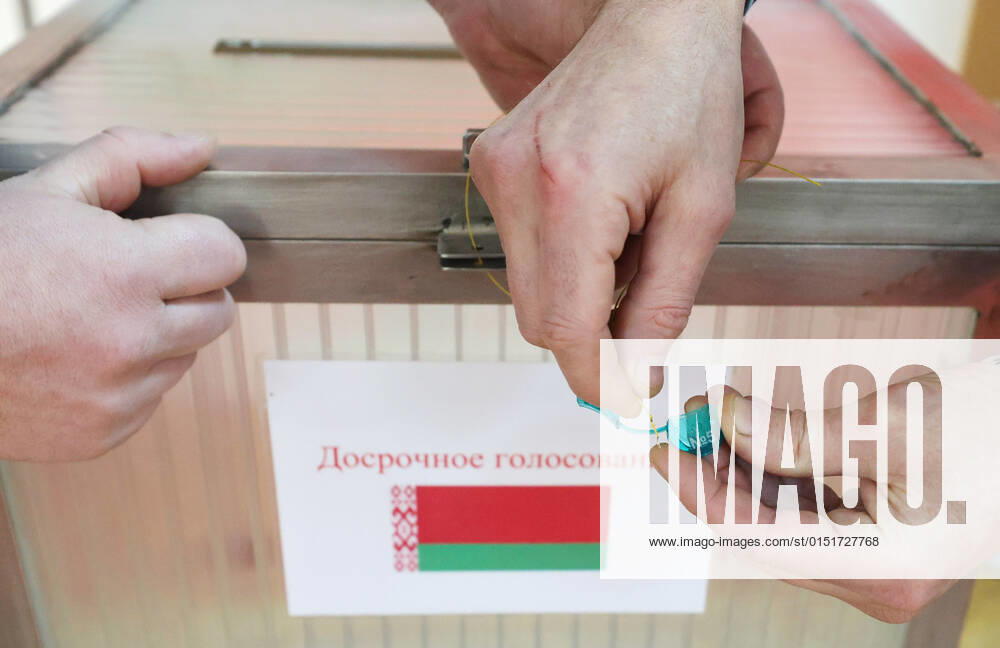 Local electoral commission members seal a ballot box at polling station No 5 ahead of the start of early voting in the 2022 Belarusian constitutional referendum, which is scheduled for February 27. Alexander Khitrov BelTA TASS TS124EA3