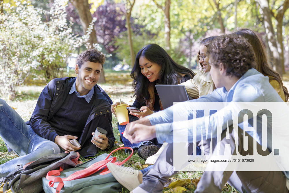 Smiling friends spending leisure time in college park model released, IFRF01486