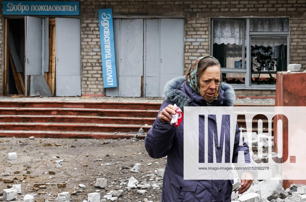GORLOVLKA, DONETSK REGION, DONETSK PEOPLE S REPUBLIC - FEBRUARY 25, 2022: A woman is seen outside Secondary School No 50 in Sokolovskogo Street damaged in a shelling attack by the Ukrainian troops. According to preliminary data, two school teachers were killed. Tensions started heating up in Donbass on February 17, with the Donetsk and Lugansk People s Republics reporting the most intense shellfire in months. On February 19, both republics announced a general mobilisation. Alexander Ryumin TASS TS1255A5